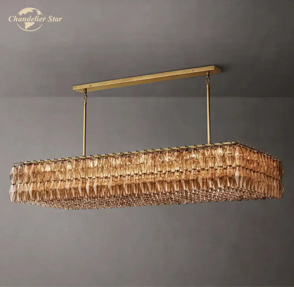 Gold-toned rectangular decorbites chiara smoke glass linear chandelier with cascading amber crystal prisms for dining and living room