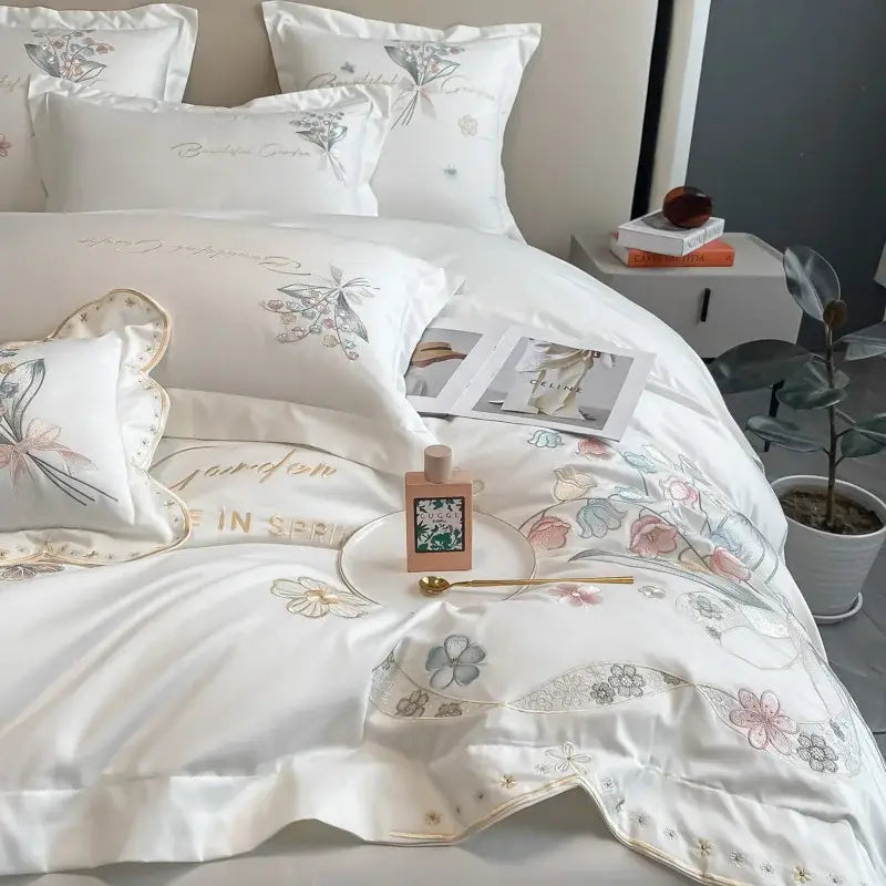 White satin bedding set with decorbites chic flowers embroidery in pastel hues gold thread on 100% egyptian cotton