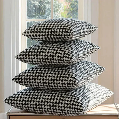 Stack of four black and white decorbites chic houndstooth cushion covers for modern home decor