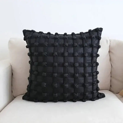 Black quilted decorbites chic pillow with textured grid pattern of raised pom-poms in chic pillow cover set