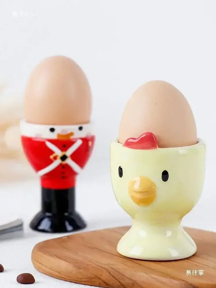 Yellow ceramic chicken-shaped egg cup holder with red heart by DecorBites for kids breakfast tableware