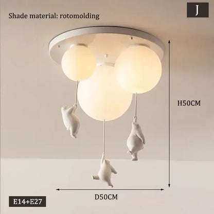 White rotomolded ceiling chandelier with three spherical shades and dangling bear astronaut figurines by decorbites children nordic