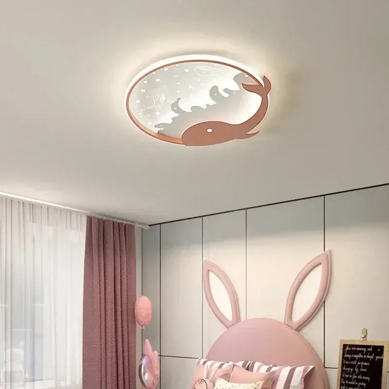 Decorbites™ children’s led ceiling lamp featuring a round design with a pink whale and starry night sky pattern