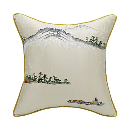 Cream-colored velvet pillow cover with chinoiserie landscape embroidered mountain scene and yellow border by decorbites