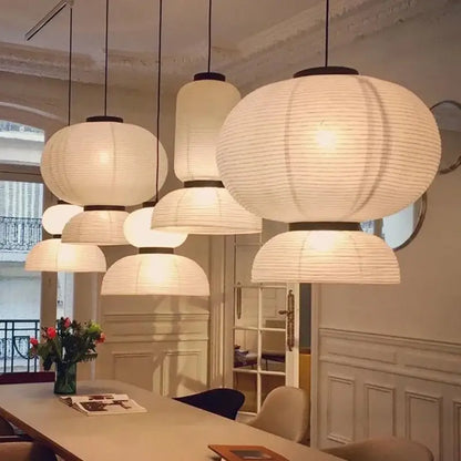 White paper lantern pendant light with black metal accents by decorbites ideal for living room and restaurant decor