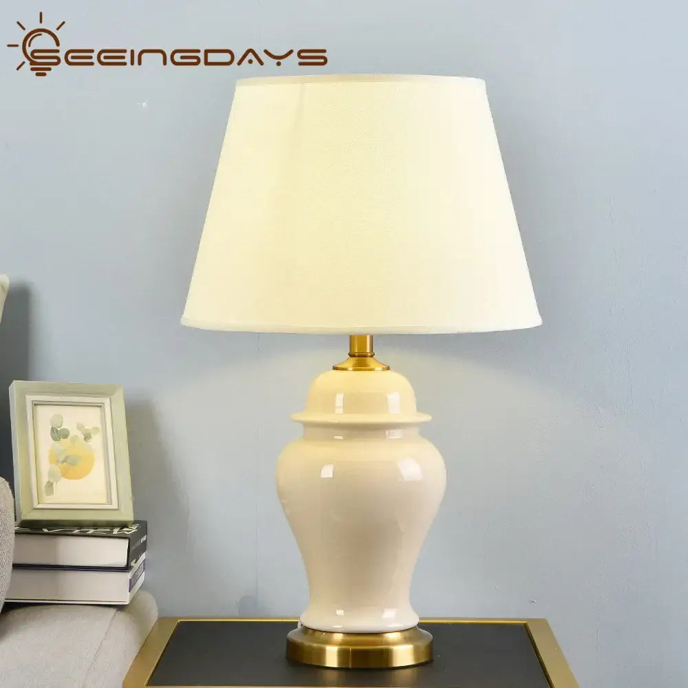 Decorbites™ cream ceramic table lamp with gold metal base and off-white fabric shade for living room bedside decor
