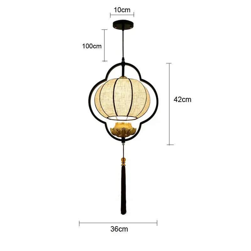 Black metal frame DecorBites™ pendant light with beige woven shade and gold lotus base for elegant tea house decor