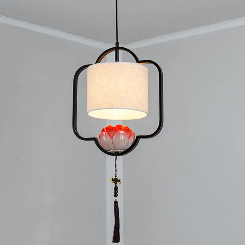 Black metal frame decorbites cloth chandelier with cream fabric shade and orange-red lotus accent for bedroom and dining room