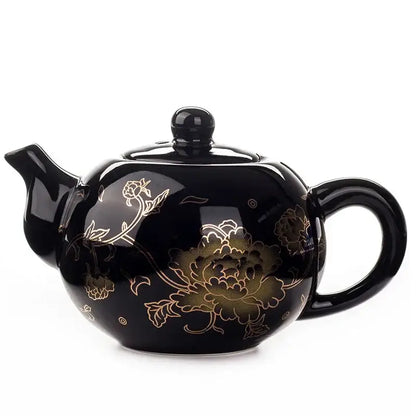 Black ceramic tea pot with gold floral patterns and glossy finish from DecorBites™ dragon ceramic red tea set