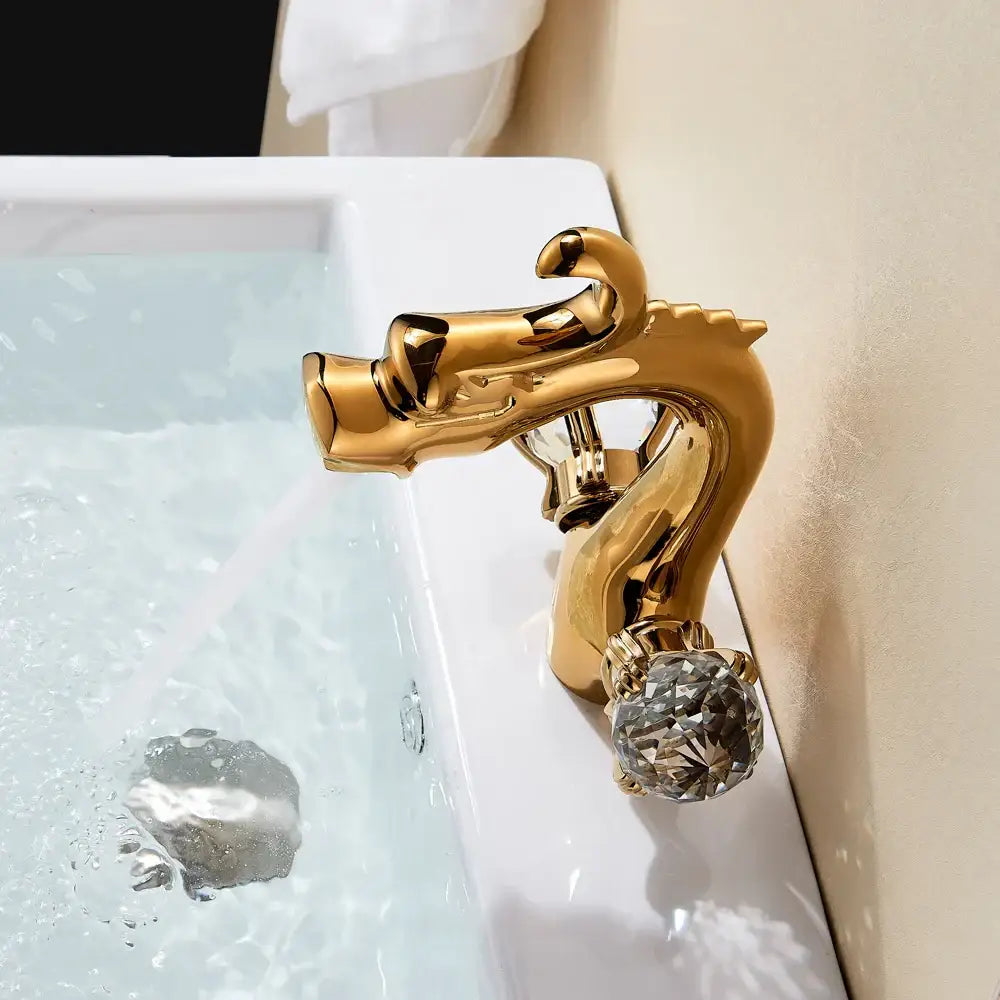 Decorbites™ basin faucet featuring a golden dragon crystal handle with a deck mounted dual hot cold design