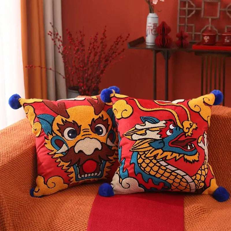 DecorBites™ Chinese dragon embroidered cushion cover in vibrant red with blue pom-pom accents for festive decor