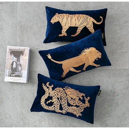 Set of three navy blue velvet pillow covers with gold tiger, lion, and dragon embroidery lumbar designs by DecorBites