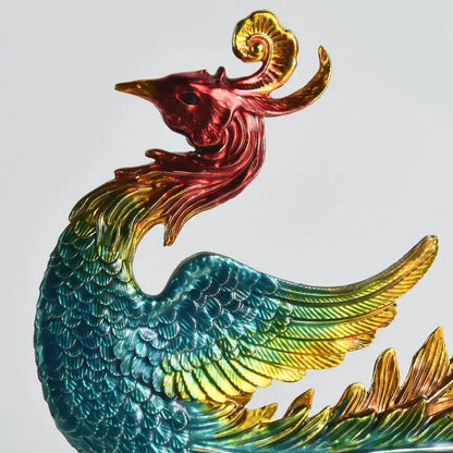 A vibrant iridescent chinese dragon phoenix figurine by decorbites with glossy red gold teal feathers for modern decor