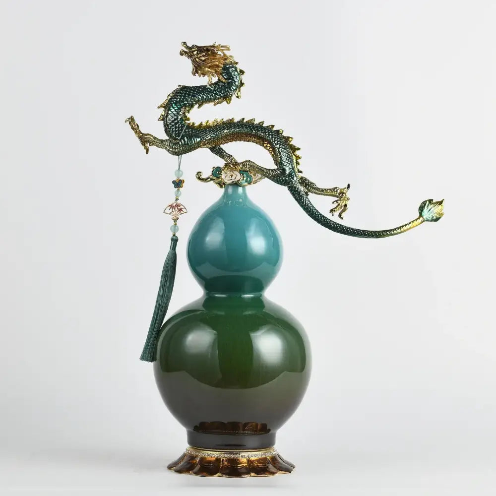 A glossy green double-gourd ceramic vase with a golden chinese dragon sculpture and tassel by decorbites chinese dragon phoenix decor