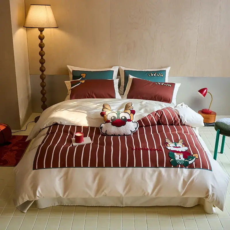 Red and white striped king size duvet cover with embroidered cartoon reindeer design in cotton bedding set by DecorBites