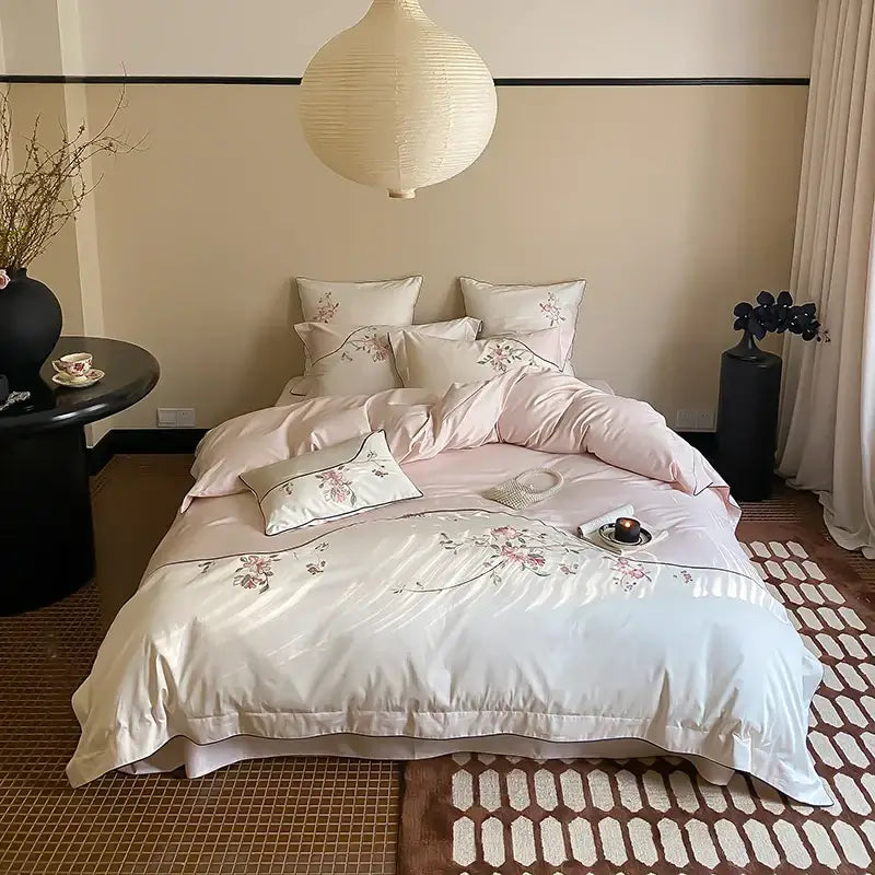 Elegant ivory satin bedding set with delicate pink chinese flowers embroidery by DecorBites chinese flowers luxury collection