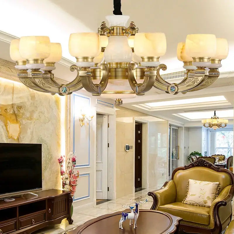 Gold-toned decorbites jade chandelier with ornate detailing and frosted glass shades all-copper lighting fixture