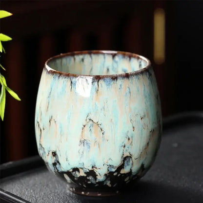 A handcrafted ceramic coffee cup with turquoise beige and dark brown mottled glaze from decorbites™ coffee cup set