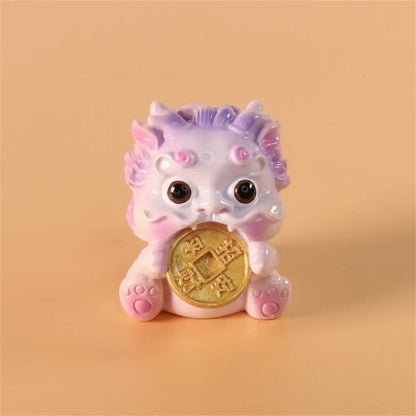 A pastel pink and lavender ceramic mythology lion figurine holding a golden coin from decorbites for luck and wealth