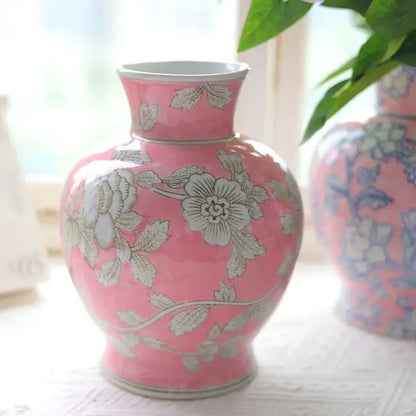 A glossy pink ceramic vase with delicate silver floral patterns from decorbites chinese retro blue white porcelain vase collection