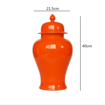 Vibrant orange ceramic general jar vase with matching lid and decorative finial for home decor and storage