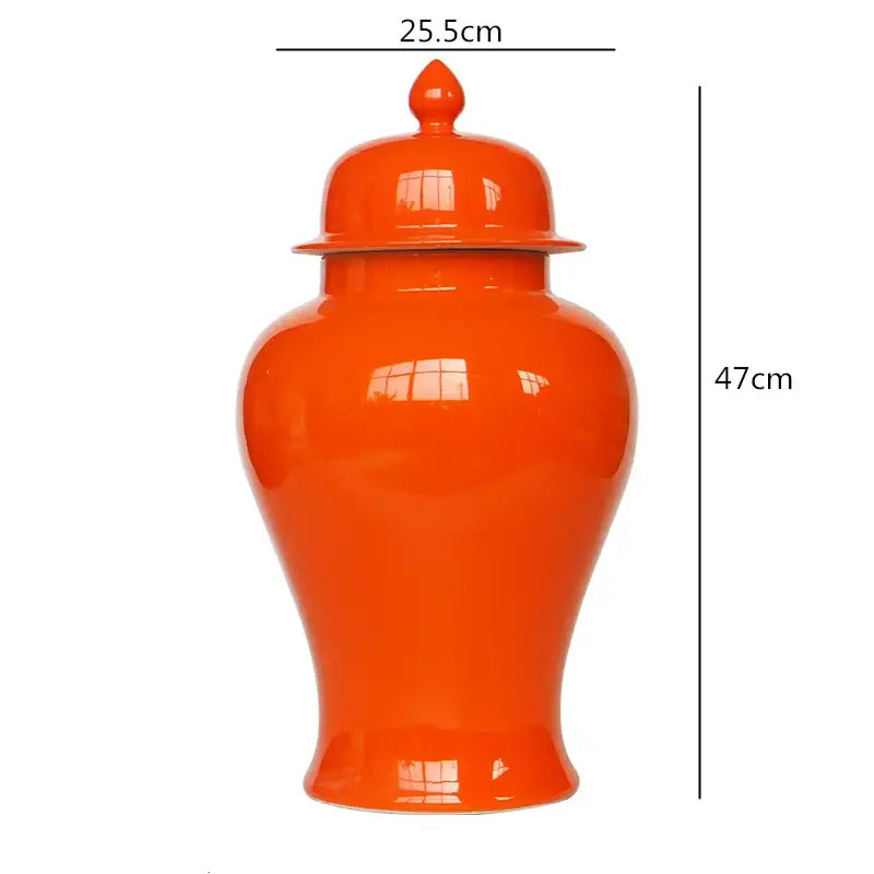 Vibrant orange ceramic general jar vase with matching lid and decorative finial for home decor and storage