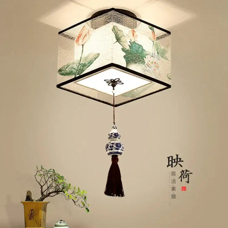 Decorbites chinese style ceiling lamp with translucent fabric shade hand-painted lotus motifs and blue porcelain accents