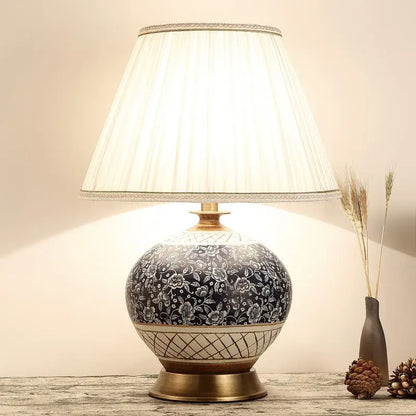 DecorBites™ Chinese style ceramic copper table lamp with black floral patterns and cream fabric shade for living room