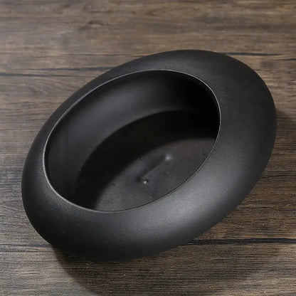 Black matte ceramic flowerpot vase with oval shape smooth rim and shallow interior for bonsai floral decor