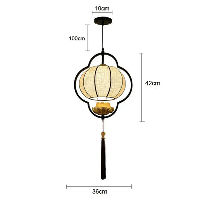 Black metal frame teahouse lantern chandelier with beige woven fabric shade and gold lotus flower detail for dining room