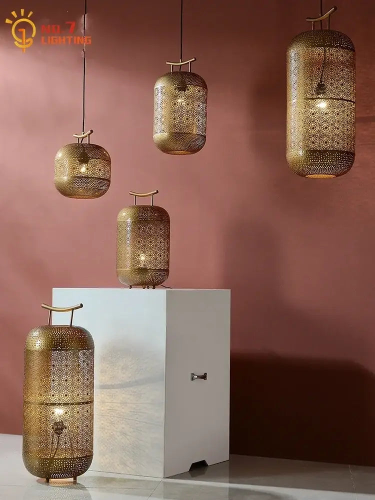 Gold-toned intricately perforated moroccan-inspired zen art birdcage pendant light for restaurant tea room by decorbites