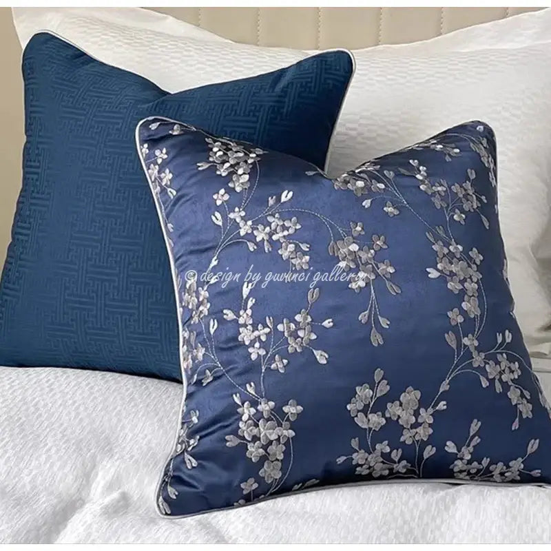 Decorbites chinoiserie blue peony cushion cover in deep blue satin with silver floral embroidery and stitched border