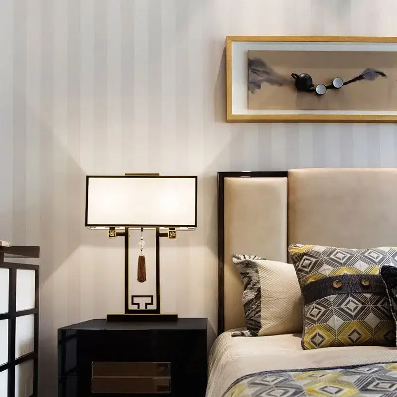 Black rectangular DecorBites chinoiserie style floor lamp with white shade, gold accents, and ornate geometric base for living room
