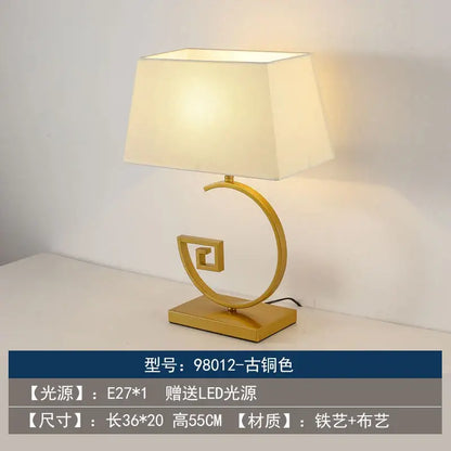 Gold-finished decorbites chinoiserie table floor lamp with cream fabric shade and ornate spiral base for elegant lighting