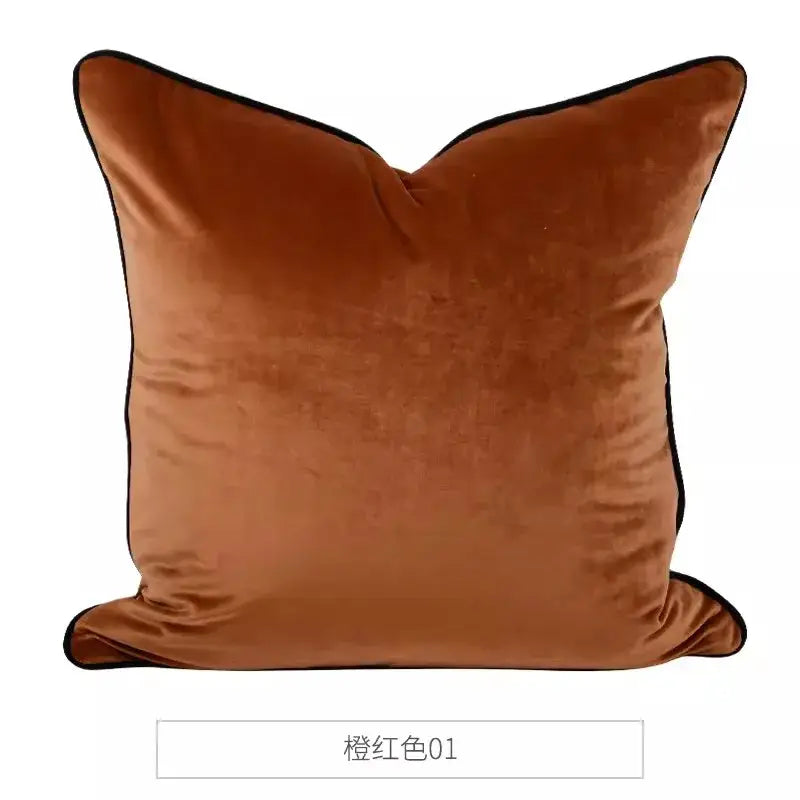A plush burnt orange velvet DecorBites chinoiserie velvet lumbar pillow cover with black piping edges 30x50cm