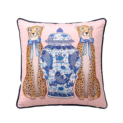 Pink cushion cover with embroidered cheetahs and blue bows beside a blue white porcelain vase from decorbites chinoiserie zebra peonies cushion cover