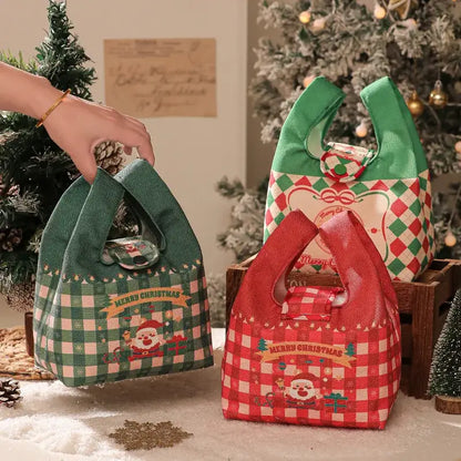 Green and red checkered christmas apple handheld plush gift bag with santa illustration by decorbites christmas apple