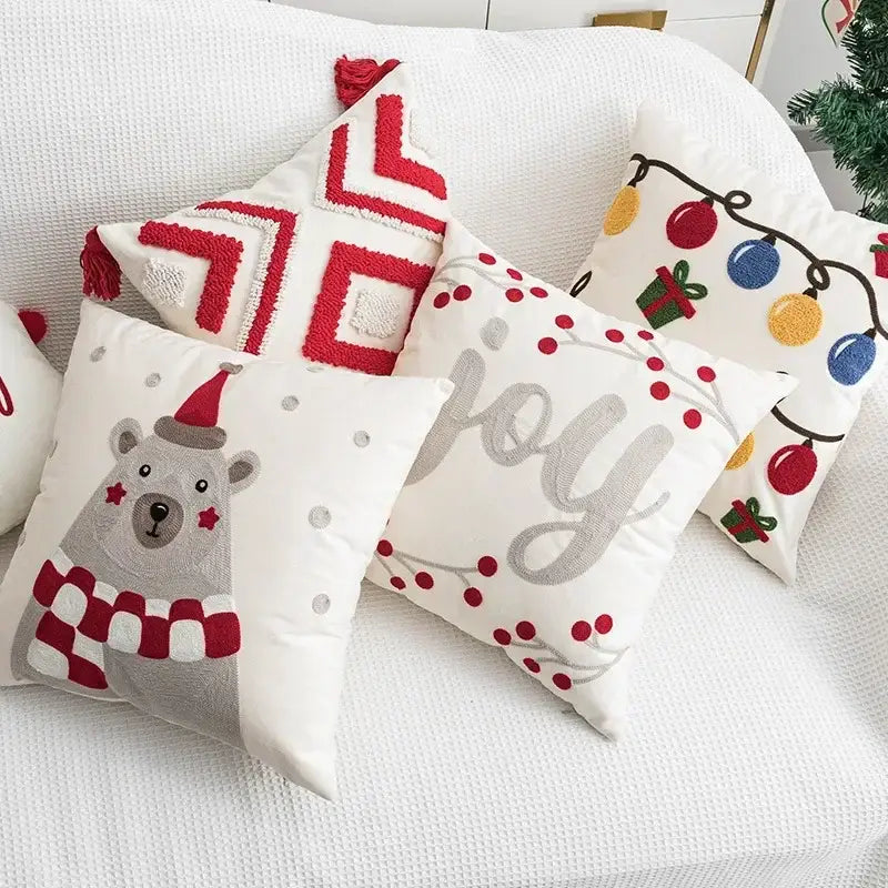 White christmas-themed embroidered pillow cover with festive bear, lights, geometric patterns, and silver joy text by decorbites christmas bell red