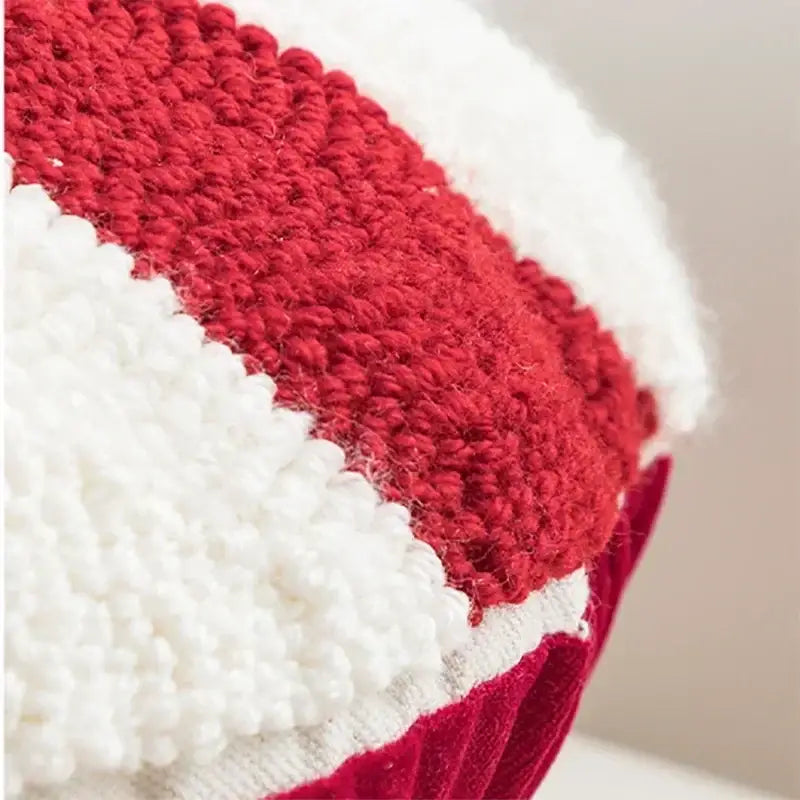 Red and white knitted plush hat with chunky texture featured in decorbites christmas cartoon candy cushion cover