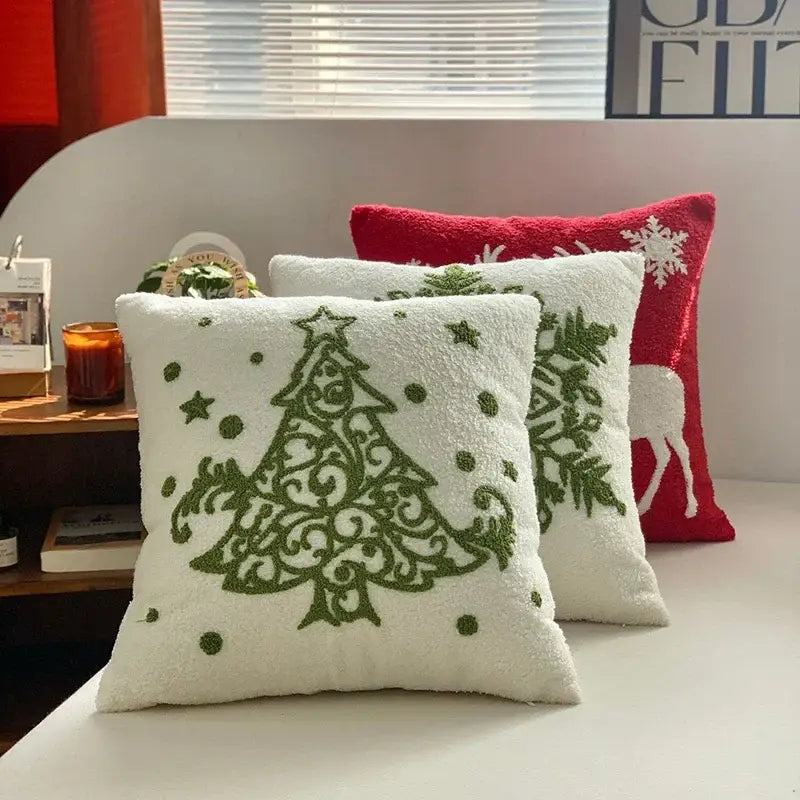 White plush embroidered pillow with green christmas tree and star accents from decorbites christmas cartoon set