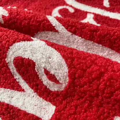 Red plush towel with white embroidered script design for decorbites christmas cartoon embroidered pillow set
