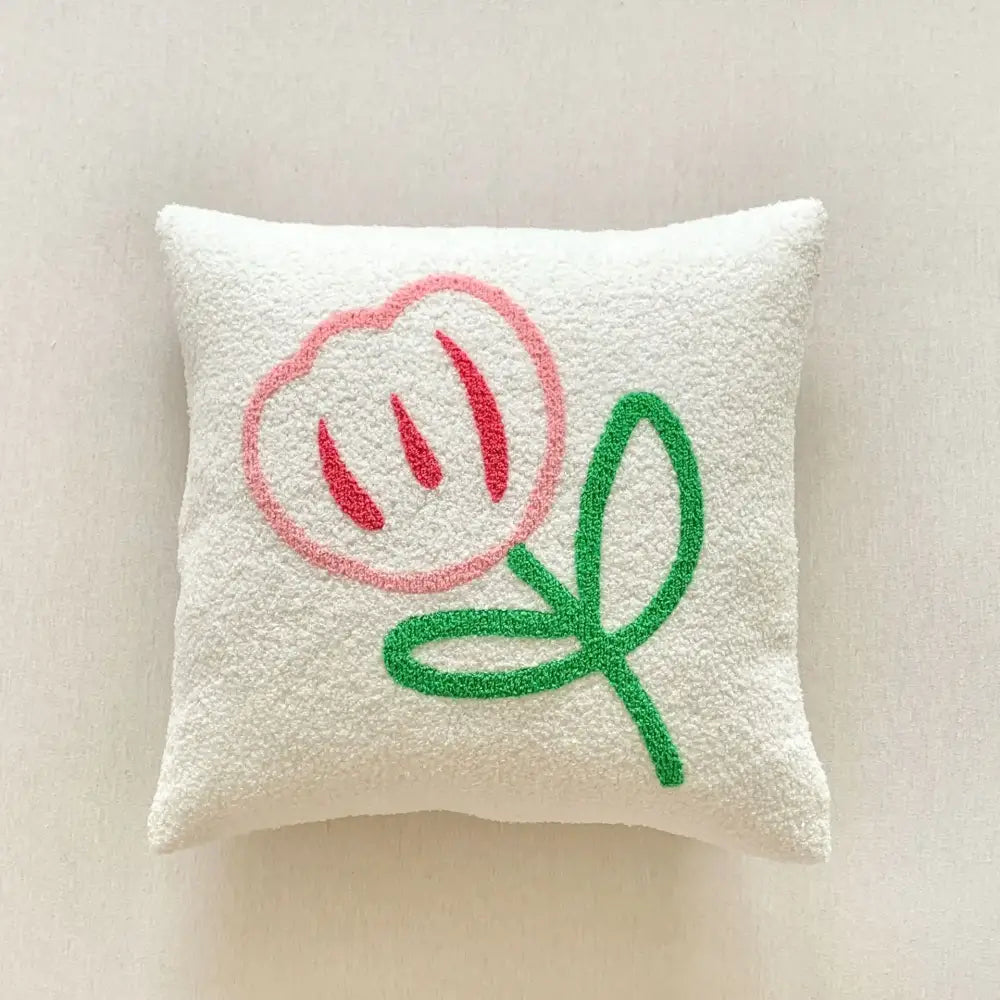 A soft white decorbites christmas cartoon pillow cover with playful pink flower embroidery for festive sofa decor
