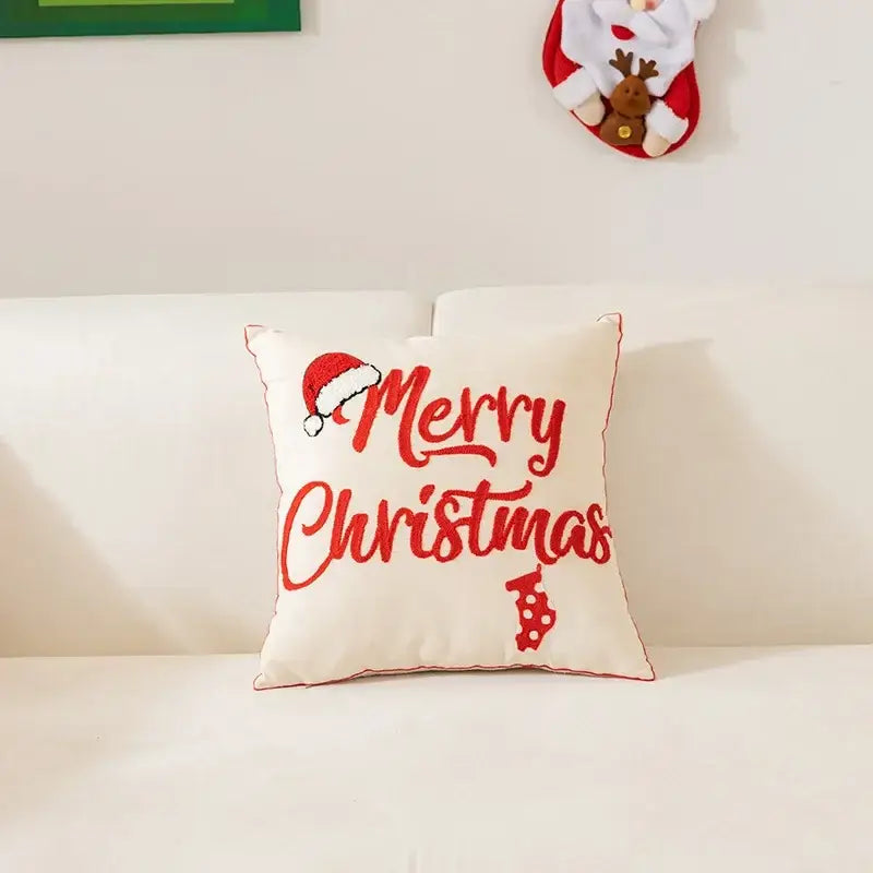 Cream-colored decorbites christmas cartoon pillow cover with red embroidered christmas cartoon letter and santa hat design