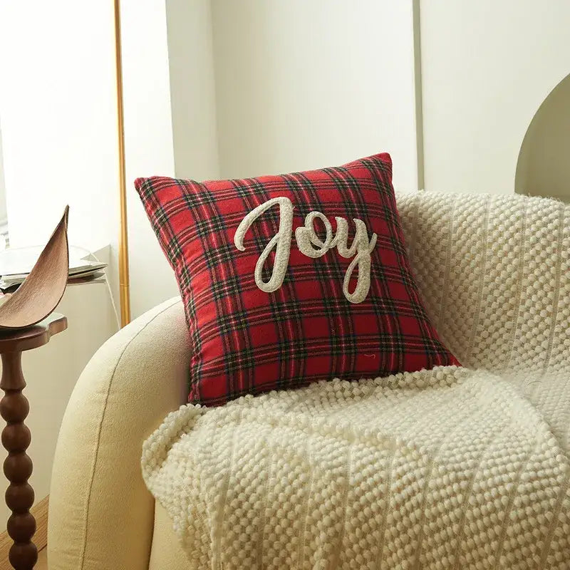 Red plaid pillow cover with embroidered white joy lettering from decorbites christmas cartoon festive sofa cushion collection
