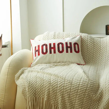 White rectangular pillow cover with red ho ho ho lettering plaid pattern and red border from DecorBites christmas cartoon collection