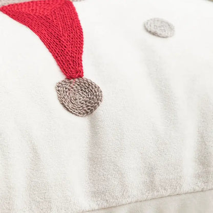 White plush snowman pillow with red knitted hat and gray nose in decorbites christmas day embroidered pillowcase