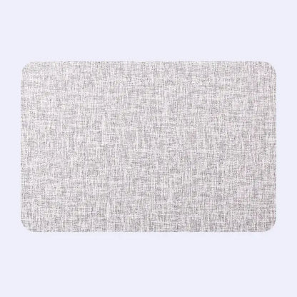 Rectangular gray textured placemat with subtle woven pattern from decorbites christmas decor placemat set