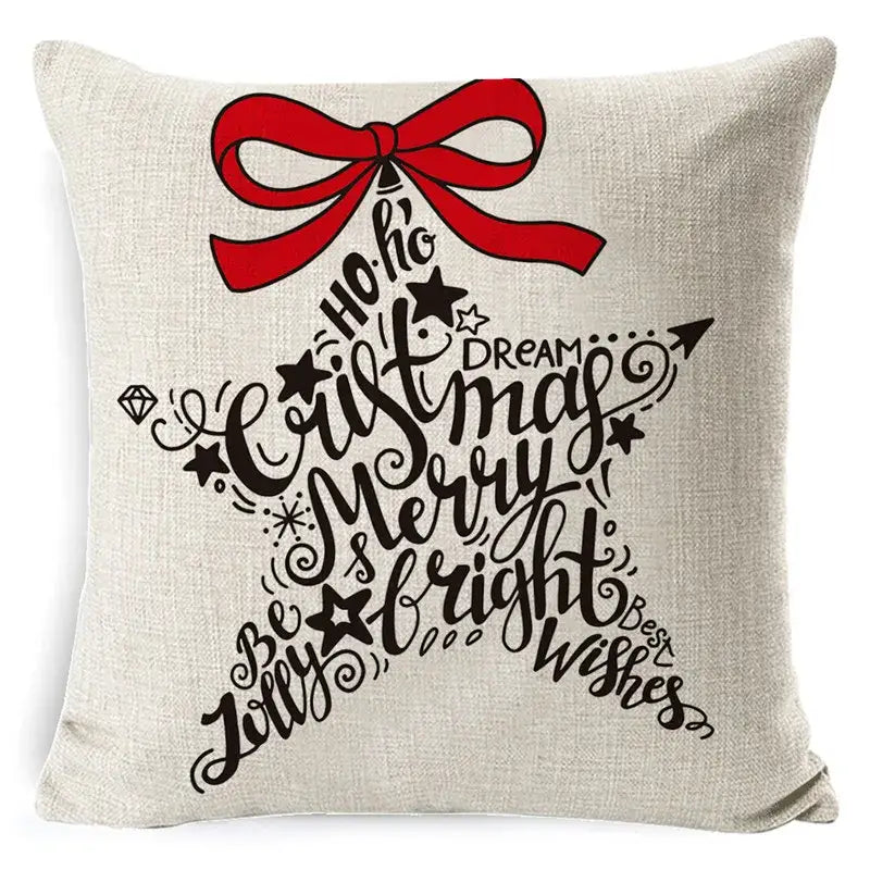 Beige linen pillow cover with festive star design red bow and black cursive holiday text decorbites christmas deer