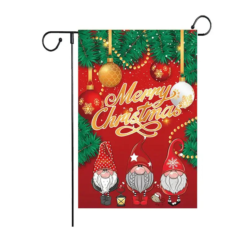 Red christmas garden flag by decorbites featuring three cartoon gnomes pine branches and gold lettering for outdoor use
