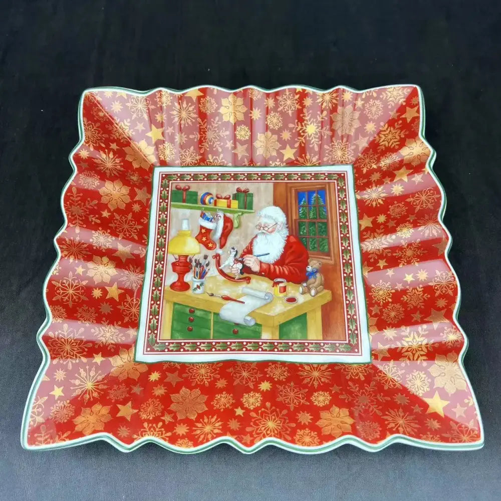 Red and gold snowflake ceramic serving dish with santa claus workshop illustration from decorbites christmas dinnerware set